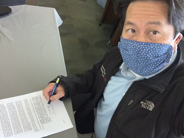 M.Wong signing the Reverter Deed